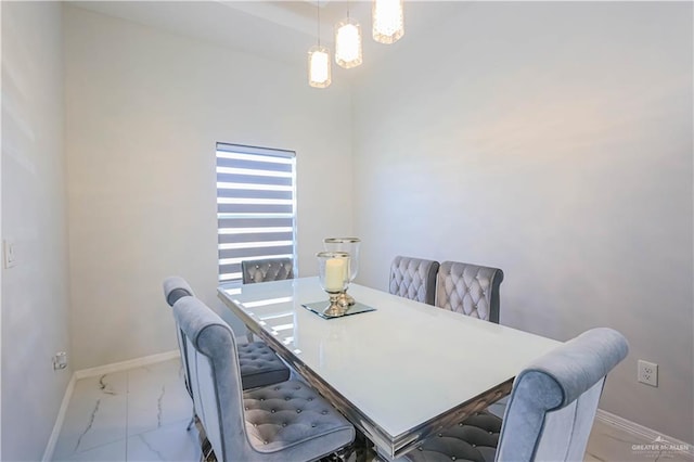 dining area featuring an inviting chandelier