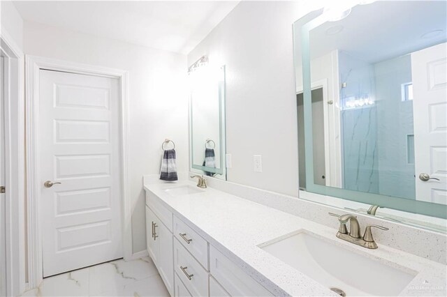 bathroom with vanity and walk in shower