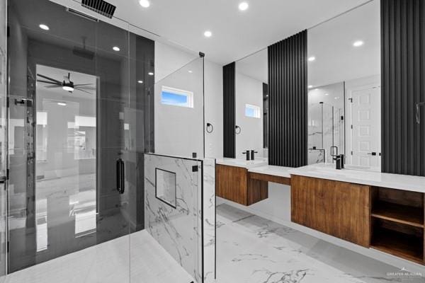 bathroom featuring vanity, an enclosed shower, and ceiling fan