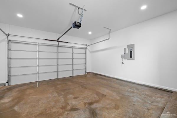 garage featuring a garage door opener and electric panel