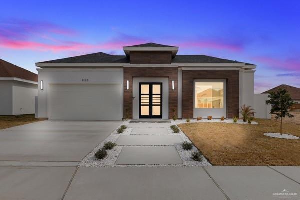 prairie-style house featuring a garage