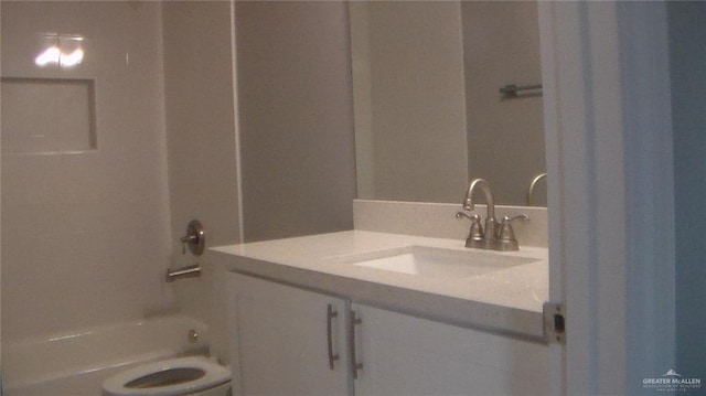 full bathroom with vanity, shower / bathtub combination, and toilet