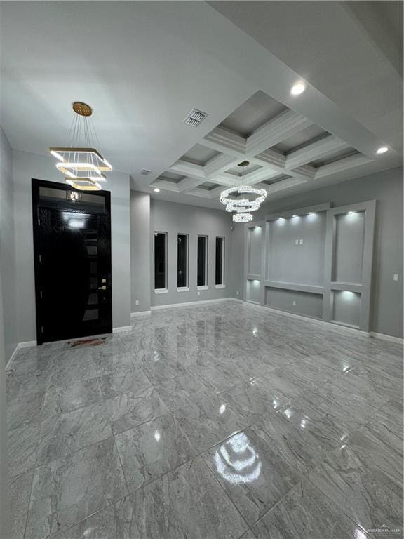 interior space with an inviting chandelier, coffered ceiling, and beam ceiling