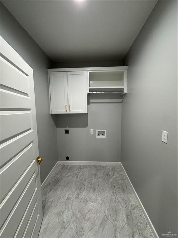 clothes washing area featuring cabinets, washer hookup, and hookup for an electric dryer