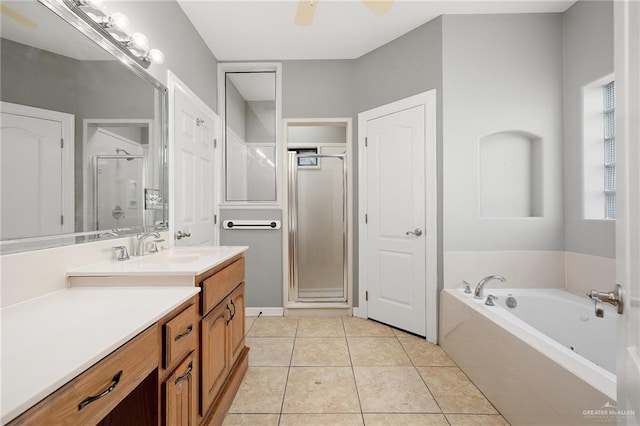 bathroom with tile patterned flooring, vanity, independent shower and bath, and ceiling fan