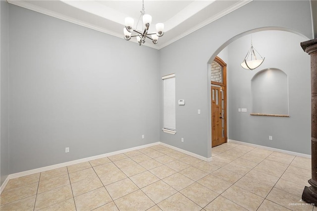 tiled spare room featuring crown molding and a notable chandelier