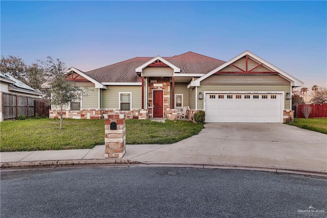 craftsman-style house with a lawn and a garage