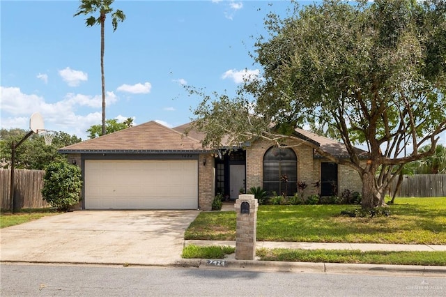 single story home featuring a garage and a front lawn