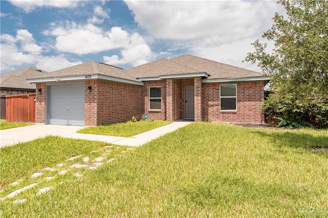 ranch-style house featuring a garage and a front yard