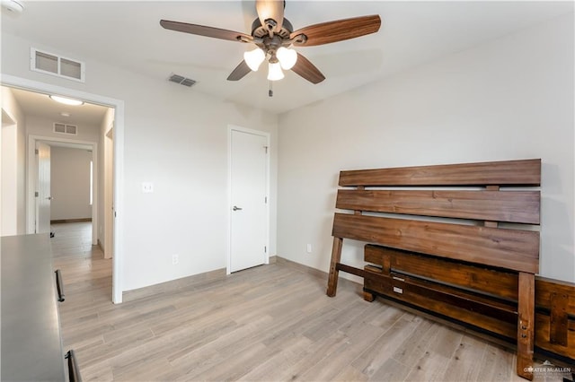 unfurnished bedroom featuring ceiling fan and light hardwood / wood-style floors