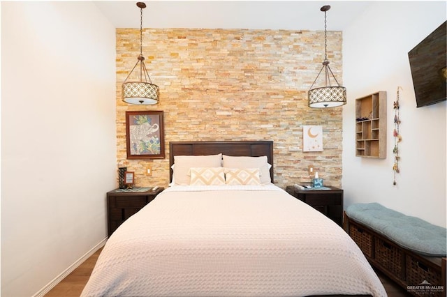 bedroom with hardwood / wood-style floors