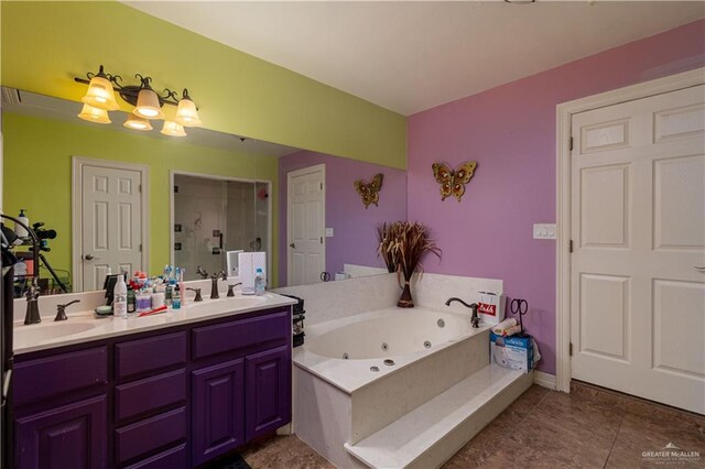 bathroom with tile patterned flooring, shower with separate bathtub, and vanity