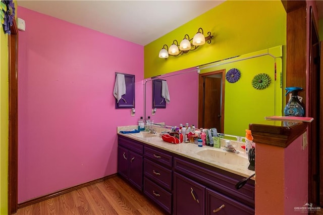 bathroom featuring hardwood / wood-style floors and vanity