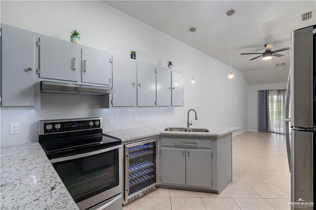 kitchen with stainless steel appliances, beverage cooler, sink, gray cabinets, and hanging light fixtures