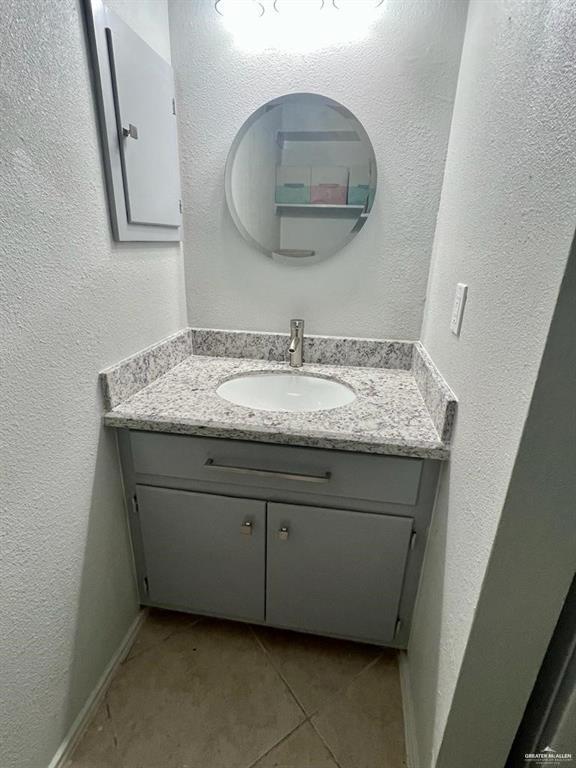 bathroom featuring tile patterned floors and vanity