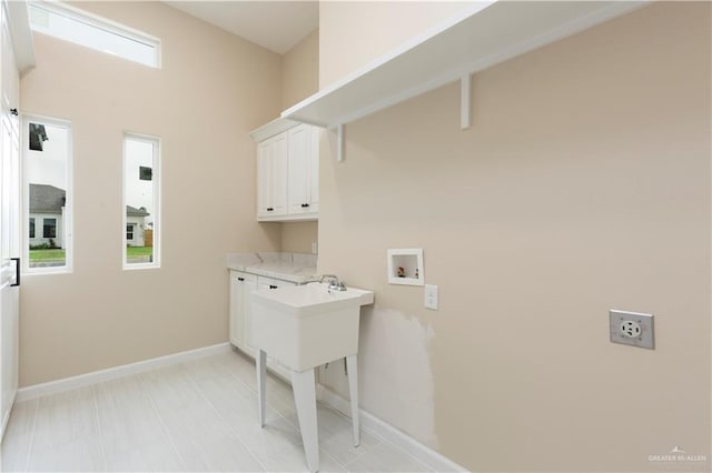 laundry area with cabinets, washer hookup, and hookup for an electric dryer