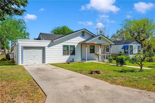 517 E Jones Ave, Pharr, TX 78577 - ranch-style home featuring covered porch, concrete driveway, a garage, and a front yard