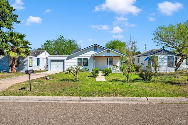 517 E Jones Ave, Pharr, TX 78577 - view of front facade with a porch, an attached garage, and concrete driveway