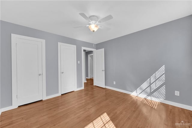 517 E Jones Ave, Pharr, TX 78577 - unfurnished bedroom with light wood-style flooring and ceiling fan