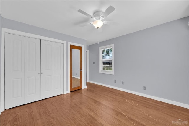 517 E Jones Ave, Pharr, TX 78577 - unfurnished bedroom with wood finished floors, a closet, and a ceiling fan