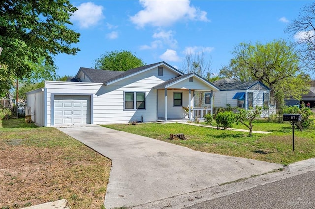 517 E Jones Ave, Pharr, TX 78577 - single story home with a garage, driveway, a front lawn, and covered porch
