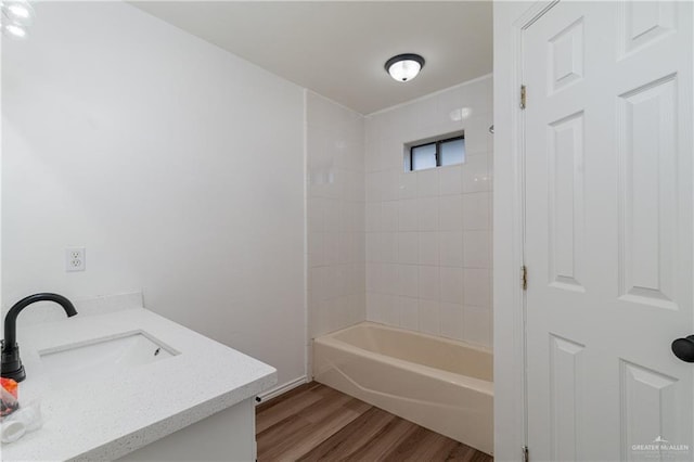 full bath featuring tub / shower combination, vanity, and wood finished floors