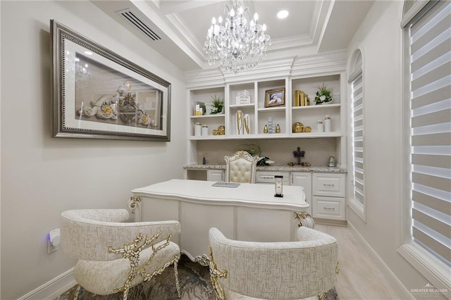 home office with a tray ceiling, an inviting chandelier, and ornamental molding