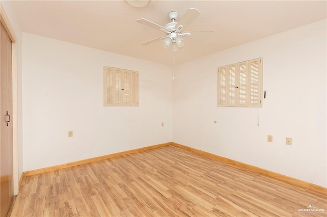 spare room featuring ceiling fan and light hardwood / wood-style floors