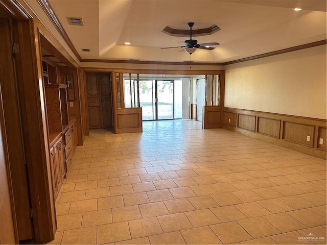 2711 Ashley Ct, Pharr, TX 78577 - spare room with a wainscoted wall, crown molding, a raised ceiling, visible vents, and a ceiling fan