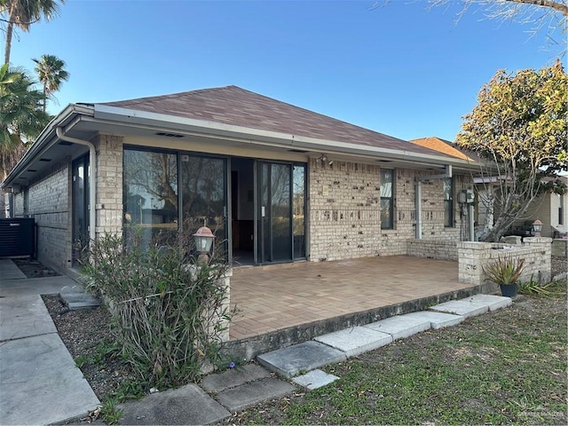 2711 Ashley Ct, Pharr, TX 78577 - rear view of house featuring brick siding and a patio