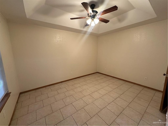 2711 Ashley Ct, Pharr, TX 78577 - unfurnished room featuring a tray ceiling, a ceiling fan, and baseboards