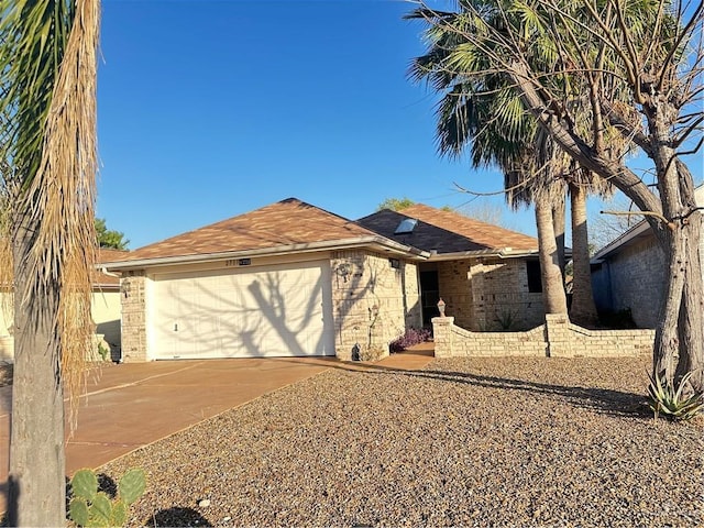 2711 Ashley Ct, Pharr, TX 78577 - ranch-style house featuring concrete driveway, brick siding, and an attached garage