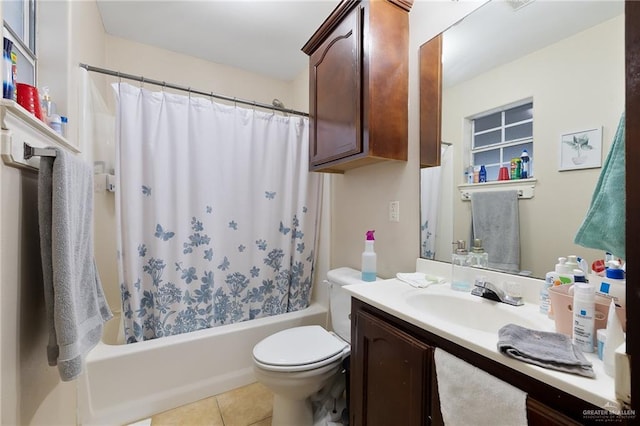 full bathroom with shower / tub combo, vanity, toilet, and tile patterned floors