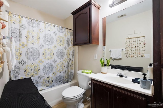 bathroom with visible vents, shower / tub combo, vanity, and toilet