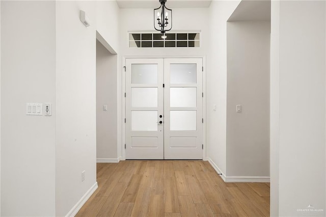 3515 Elevation Dr, Edinburg, TX 78542 - doorway with light wood-type flooring and baseboards