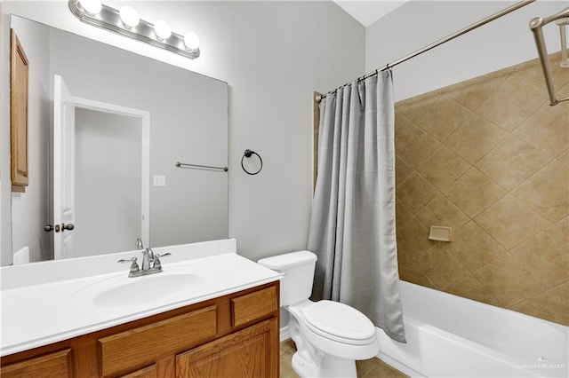 full bathroom featuring shower / bath combo with shower curtain, vanity, and toilet