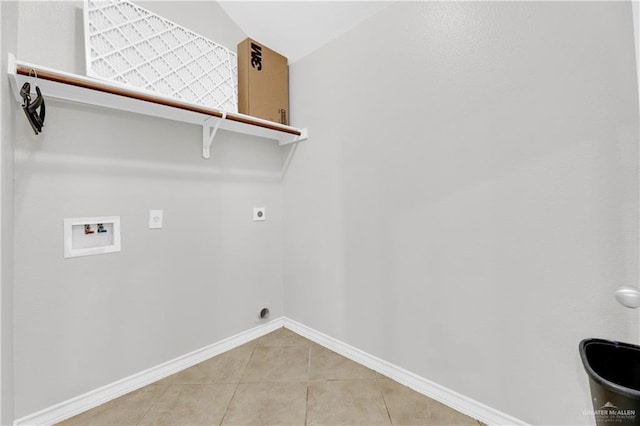 laundry area featuring electric dryer hookup, hookup for a washing machine, and tile patterned flooring