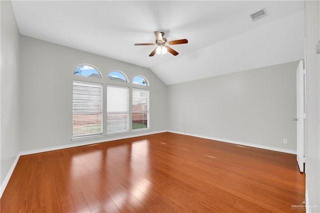 unfurnished living room with hardwood / wood-style floors, ceiling fan, and lofted ceiling