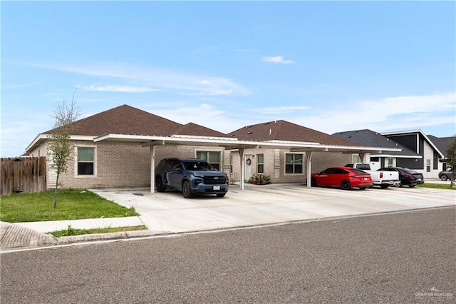 ranch-style home featuring a carport