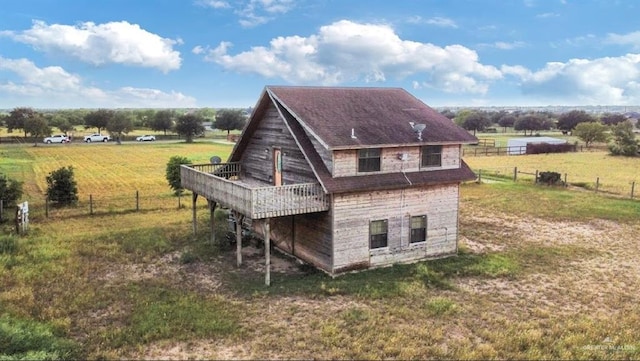 8826 Oak Meadow St W, Monte Alto, TX 78538 - rear view of property featuring a wooden deck and a view of rural / pastoral area