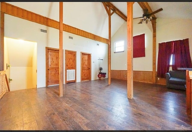 8826 Oak Meadow St W, Monte Alto, TX 78538 - unfurnished living room with a ceiling fan, high vaulted ceiling, wood finished floors, wainscoting, and beamed ceiling