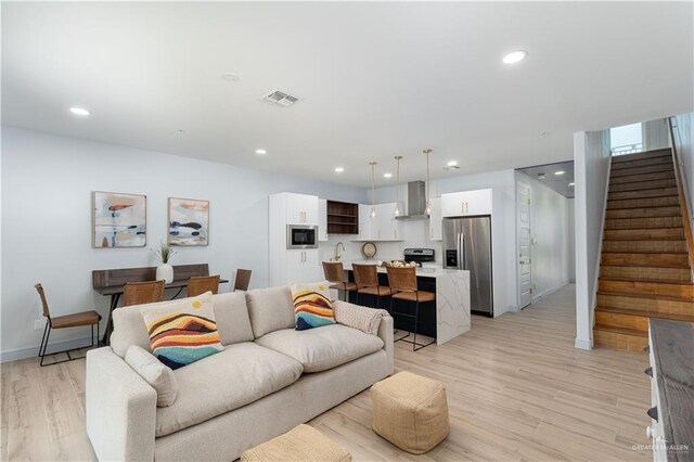 living room featuring light hardwood / wood-style floors