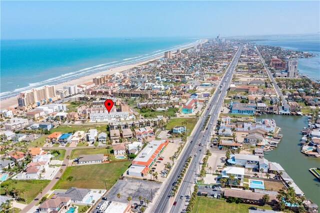 bird's eye view with a water view and a view of the beach