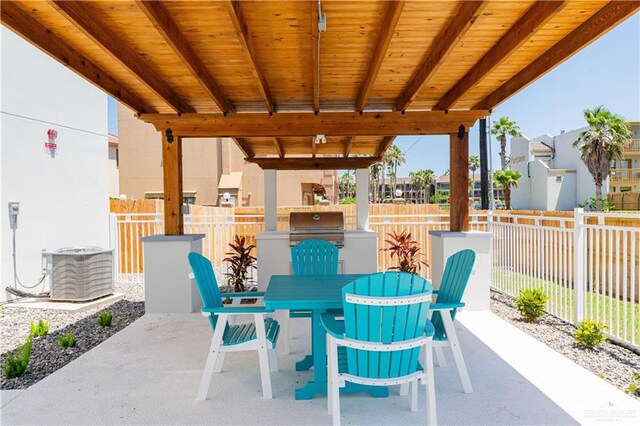 view of patio with area for grilling and cooling unit