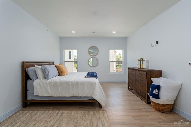 bedroom with light hardwood / wood-style floors