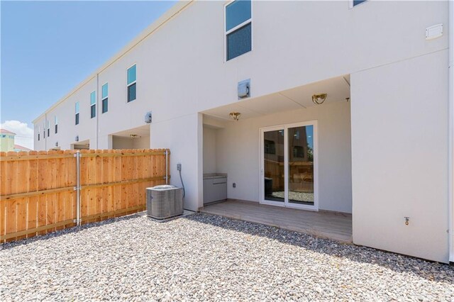 back of house with a patio and central air condition unit