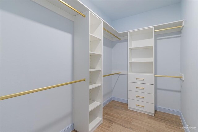 walk in closet featuring light wood-type flooring