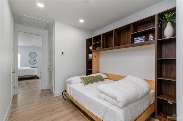 bedroom with light hardwood / wood-style flooring