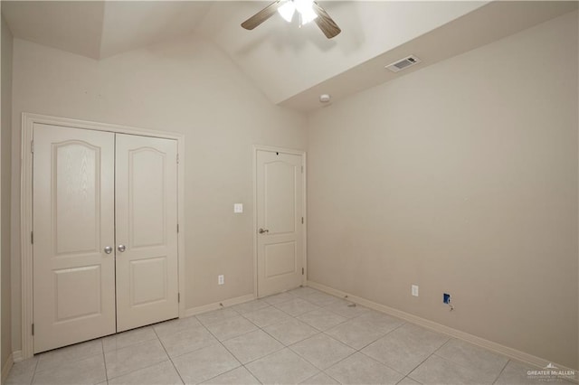 1110 E 8th St N, San Juan, TX 78589 - unfurnished bedroom featuring light tile patterned flooring, baseboards, a closet, ceiling fan, and high vaulted ceiling