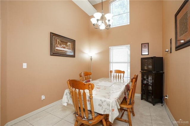 1110 E 8th St N, San Juan, TX 78589 - dining space featuring a chandelier, light tile patterned floors, baseboards, and a high ceiling